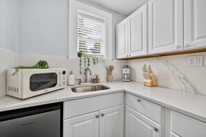 Fridge, microwave, stovetop, coffee/tea maker