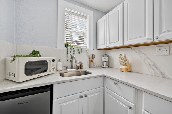 Fridge, microwave, stovetop, coffee/tea maker