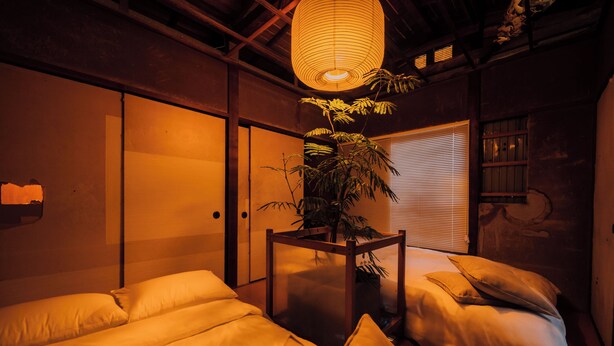 A traditional Japanese-style room with tatami flooring, a shoji screen door, and a hanging paper lantern. - Ivy Place Harajuku Urban Steel Teahouse (Tokyo)