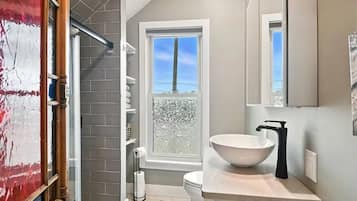 Shower, hair dryer, towels, soap
