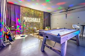 A room with a pool table, a guitar, and a neon sign reading "NASHVILLE". - Nashville rooftop, karaoke garage & game room house, sleeps 12 near downtown (Nashville)