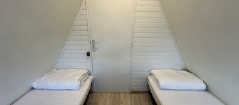 Simple chalet with shared pool on holiday park