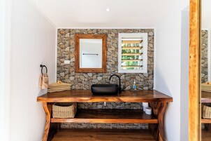 Beachfront Bure | Bathroom | Shower, towels, soap, shampoo