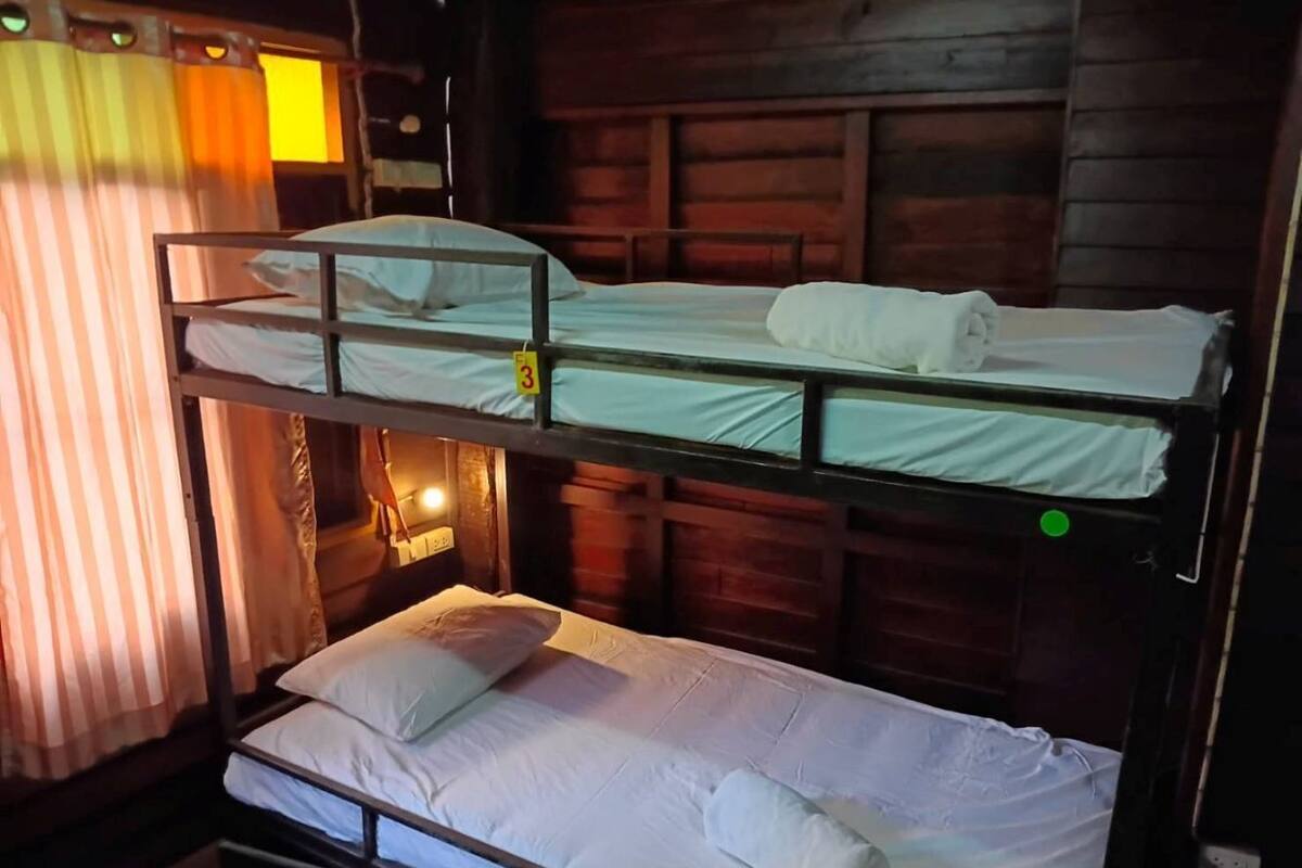 Desk, laptop workspace, bed sheets