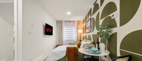 1 bedroom, desk, iron/ironing board, travel crib