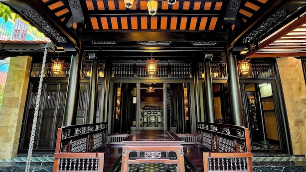 A traditional interior with a checkered floor, ornate ceiling, and a central chandelier. - Lumiere Villa Hue (Hue)