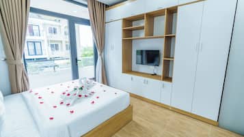 Desk, laptop workspace, blackout drapes, iron/ironing board