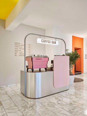A coffee bar with a menu listing various coffee types and prices. - Flemings Hotel München-schwabing (Munich)