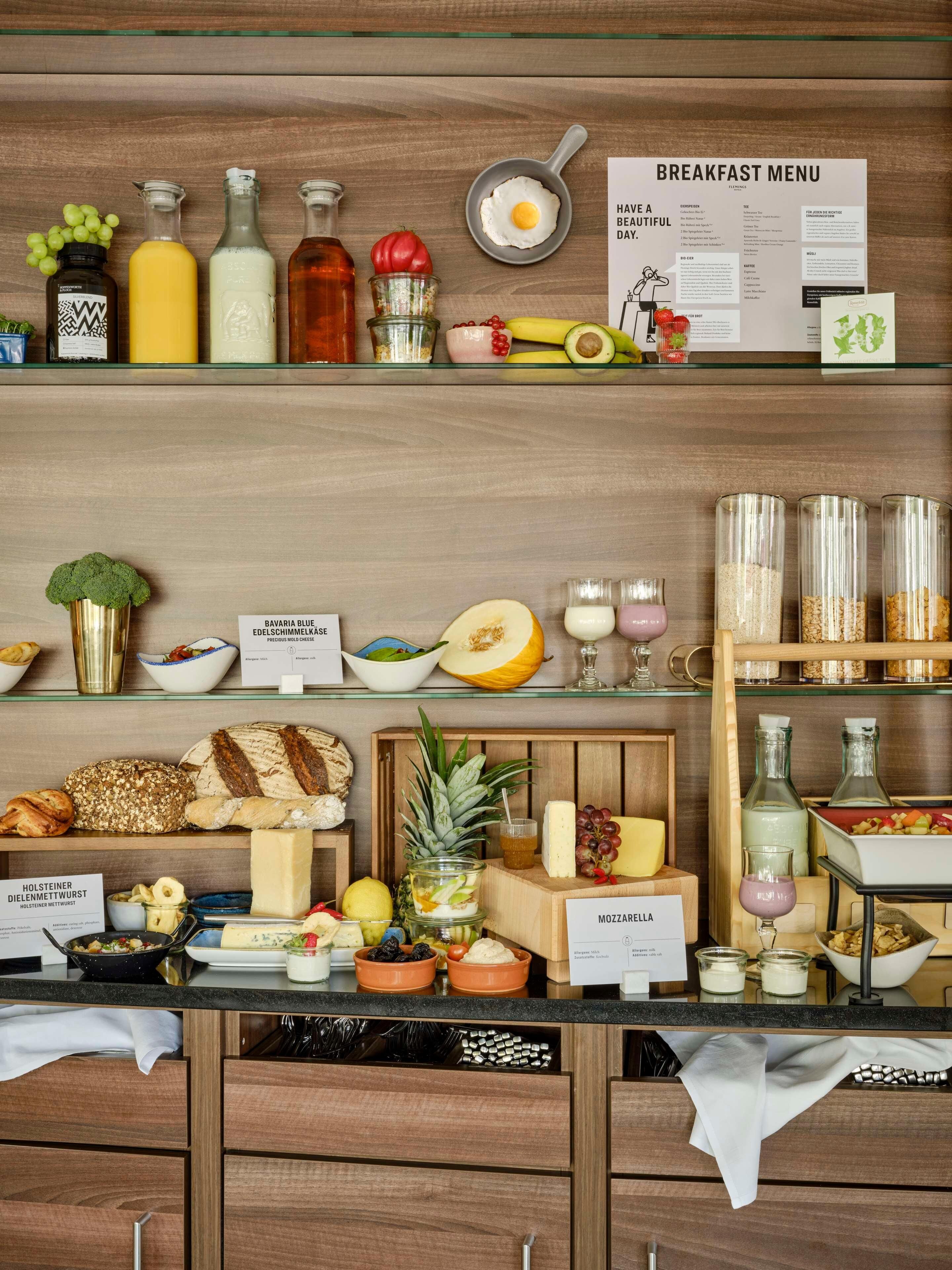 A breakfast buffet with various food items and condiments.