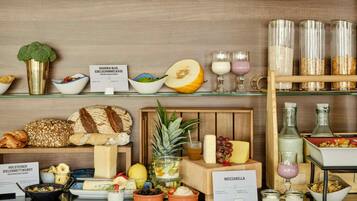 A breakfast buffet with various food items and condiments.