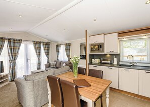 A modern kitchen with a microwave, toaster, and sink.