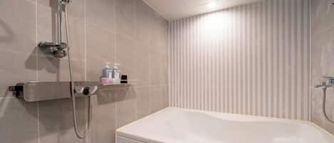 Shower, hair dryer, towels, soap