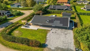 A modern residential area with houses featuring flat roofs and a mix of traditional and contemporary architecture. - "Thamina" - 200m to the fjord by Interhome (Hemmet)