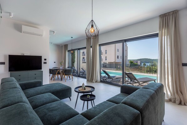 Family Villa, Multiple Bedrooms (Villa Yana with Pool and Sea View) | Living area | 21-inch flat-screen TV with cable channels - Villa Yana with Pool and Sea View (Medulin)