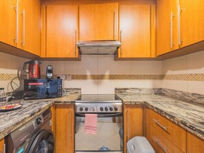 Appartement Deluxe, balcon, vue sur la ville | Cuisine privée | Cafétière à espresso, bouilloire électrique