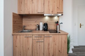 Fridge, stovetop, coffee/tea maker, cookware/dishes/utensils