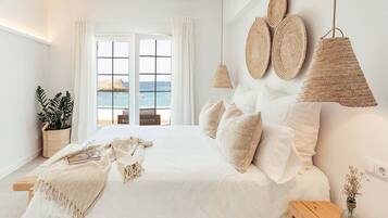 2 dormitorios, tabla de planchar con plancha, ropa de cama