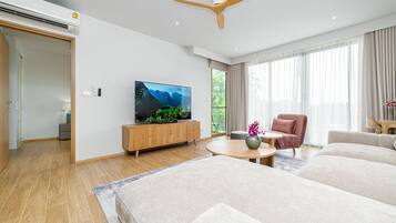 Junior Apartment, Patio | Living area | 50-inch LCD TV with digital channels