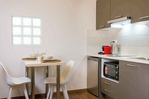 Superior Studio Suite, Mobility Accessible, City View | Private kitchen | Stovetop, espresso maker, toaster, high chair