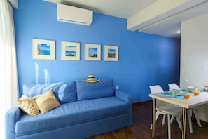 Superior Studio Suite, Garden View | Living area | 32-inch Smart TV with satellite channels