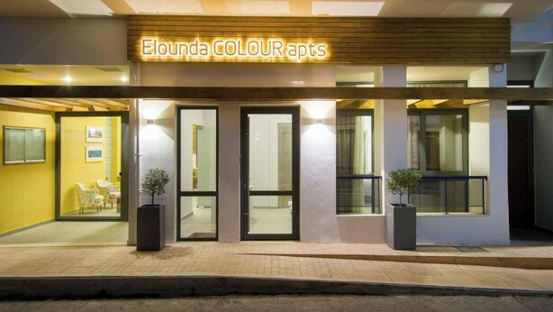 A modern building with a sign reading "Eloonda COLOUR apts". - Elounda Colour Apartments (Elounda)
