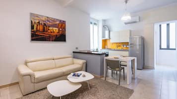 Apartment, 1 Queen Bed with Sofa bed | Living area | 30-inch TV with satellite channels