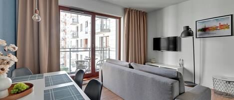 Deluxe Apartment, Balcony, River View | Living area | Flat-screen TV