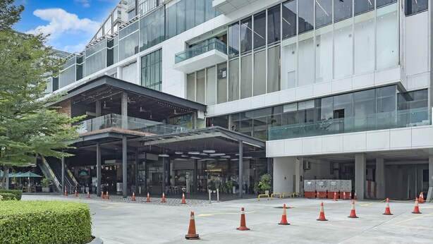 A modern building with multiple floors, large windows, and a covered entrance area. - Sunday Hotel Subang (Subang Jaya)