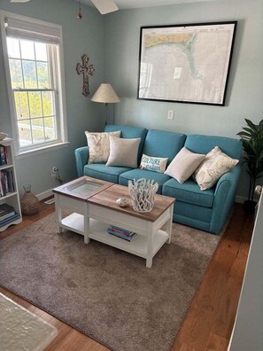 Living area - Discover "Island Time" at Holden Beach: an oceanfront 3BR for 8 guests with private pool. (Holden Beach)