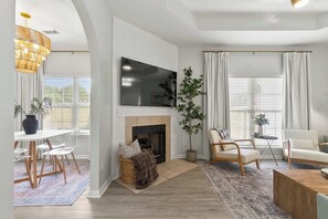 TV, fireplace - Sweet Olive | Stylish 3BR Near UA • Fire Pit (Northport)