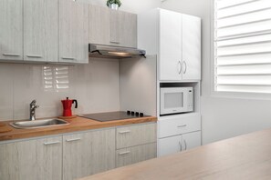 Fridge, microwave, stovetop, coffee/tea maker