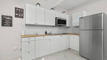 Fridge, microwave, stovetop, coffee/tea maker
