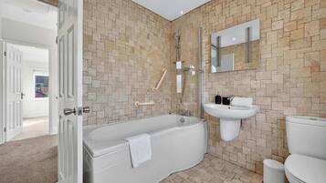 Shower, hair dryer, towels, shampoo