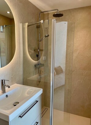 Shower, hair dryer, towels, soap