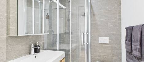 Shower, hair dryer, towels, soap