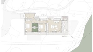 A floor plan of an apartment with a living room, kitchen, dining area, and two bedrooms. - Design apartment directly on the lake, ground floor (Bodensdorf)