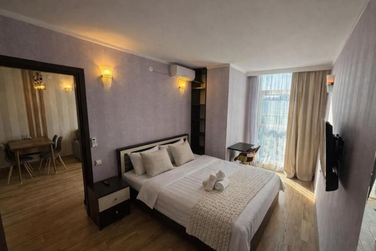 Ropa de cama de alta calidad y tabla de planchar con plancha 