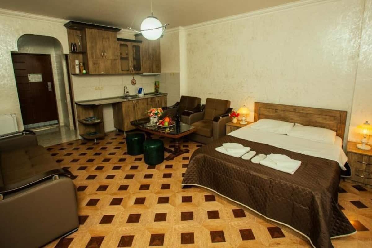 Comfort Double Room | Living area | 100-cm TV with digital channels