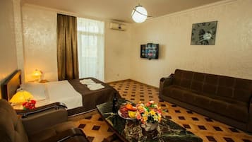Comfort Double Room | Living area | 100-cm TV with digital channels