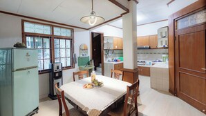 Villa | Private kitchen | Fridge, cleaning supplies, dining table - Imah Budi Luhur  (Bandung)