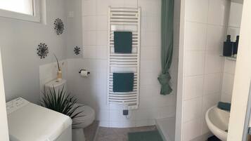 Shower, towels, soap, toilet paper