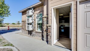 A building with a stone facade, a large open doorway, and a clear sky. - Mtn-view Escape 9 Mi to Crystal Hot Springs (Tremonton)