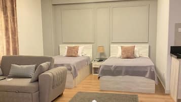 Estudio Confort, vistas a la ciudad | Edredones de plumas y sistema de insonorización