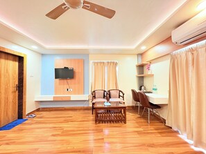 Quarto executivo, vista para a cidade | Wi-Fi de cortesia, roupa de cama