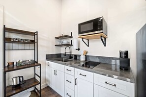 Fridge, microwave, stovetop, coffee/tea maker