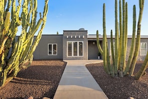 A modern building with a concrete pathway leading to the entrance. - Grand Camino Scottsdale Pool Retreat near Kierland (Scottsdale)