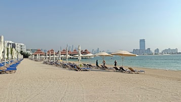 Private beach, white sand, sun-loungers, beach umbrellas
