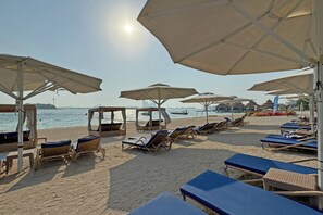 Private beach, white sand, sun-loungers, beach umbrellas