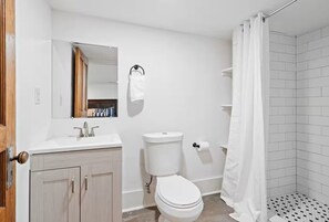 Shower, hair dryer, towels, shampoo