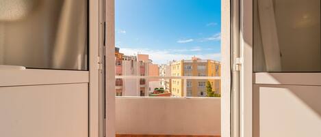 Comfort Double Room, City View | In-room safe, desk, blackout drapes, iron/ironing board